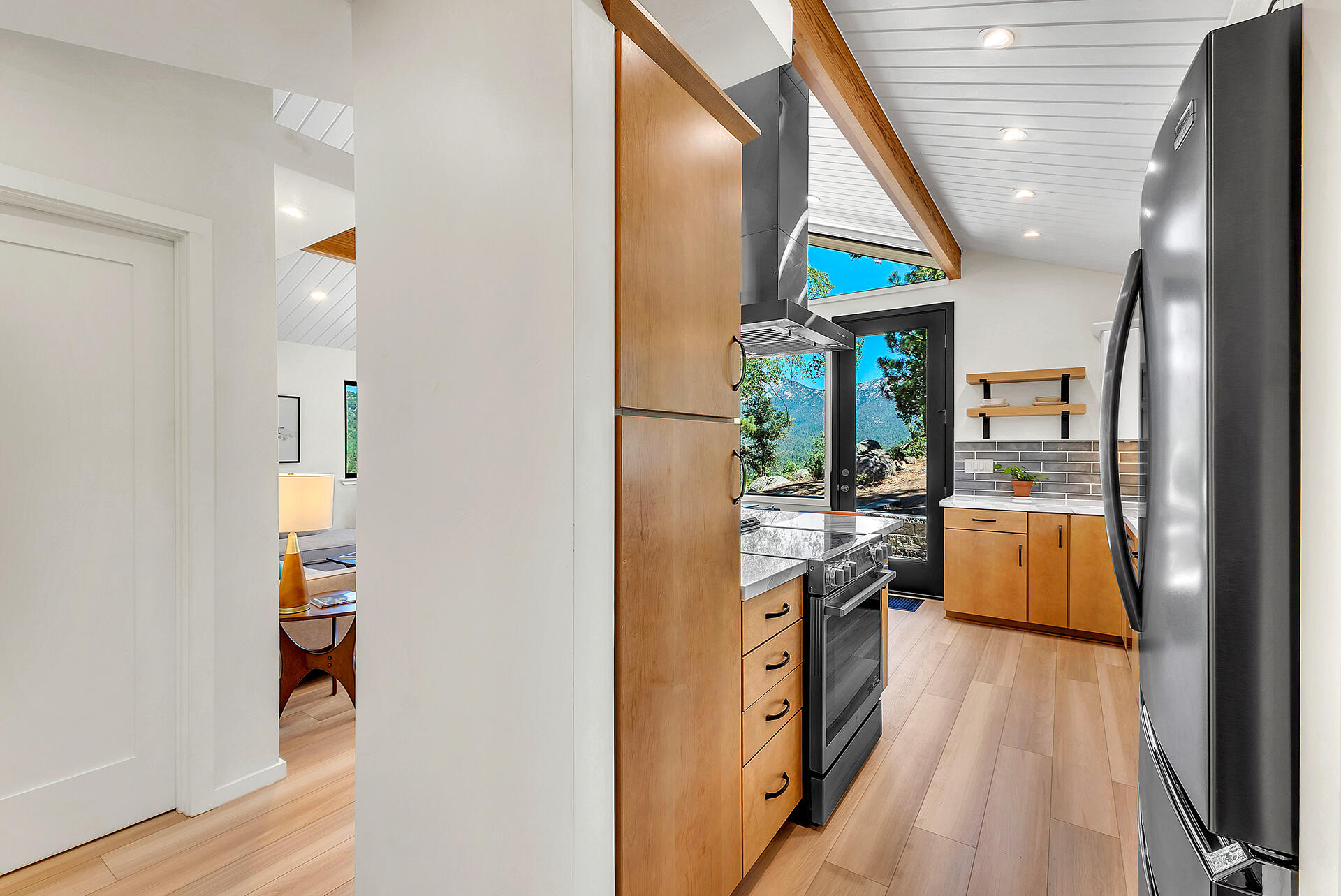 52600 Double View Drive Idyllwild, CA 92549 - Photo 18 of 75 a kitchen with stainless steel appliances granite countertop a stove a sink and a refrigerator