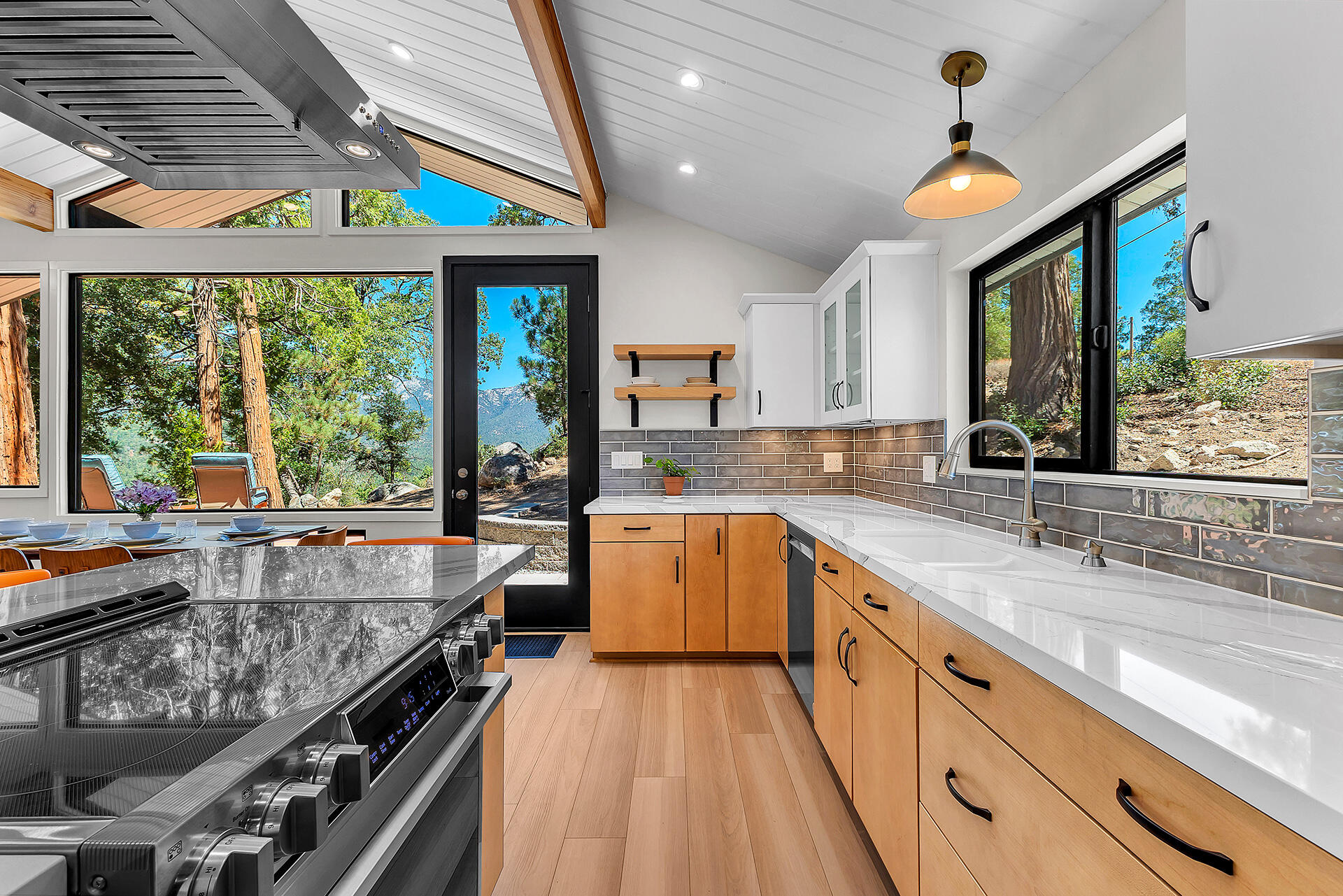52600 Double View Drive Idyllwild, CA 92549 - Photo 44 of 75 a large kitchen with kitchen island a large window a sink and appliances