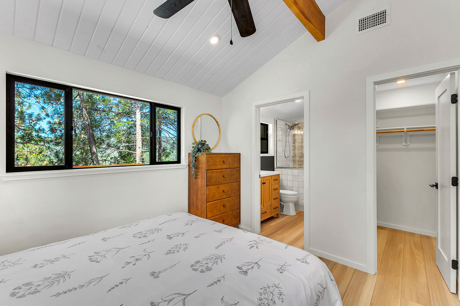 52600 Double View Drive Idyllwild, CA 92549 - Photo 49 of 75 a bedroom with a bed and a dresser next to a window