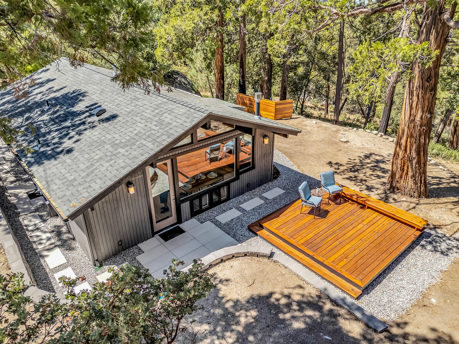 52600 Double View Drive Idyllwild, CA 92549 - Photo 60 of 75 a view of a backyard with chairs and wooden fence