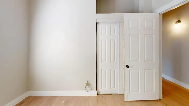 a view of a small space with wooden floor