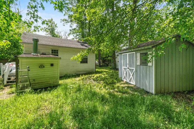 a view of a house with a back yard
