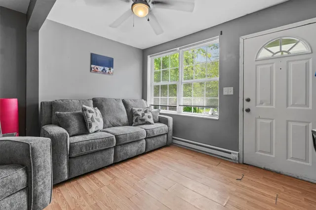 a living room with furniture and a window
