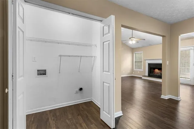 a view of livingroom with hardwood floor and a ceiling fan