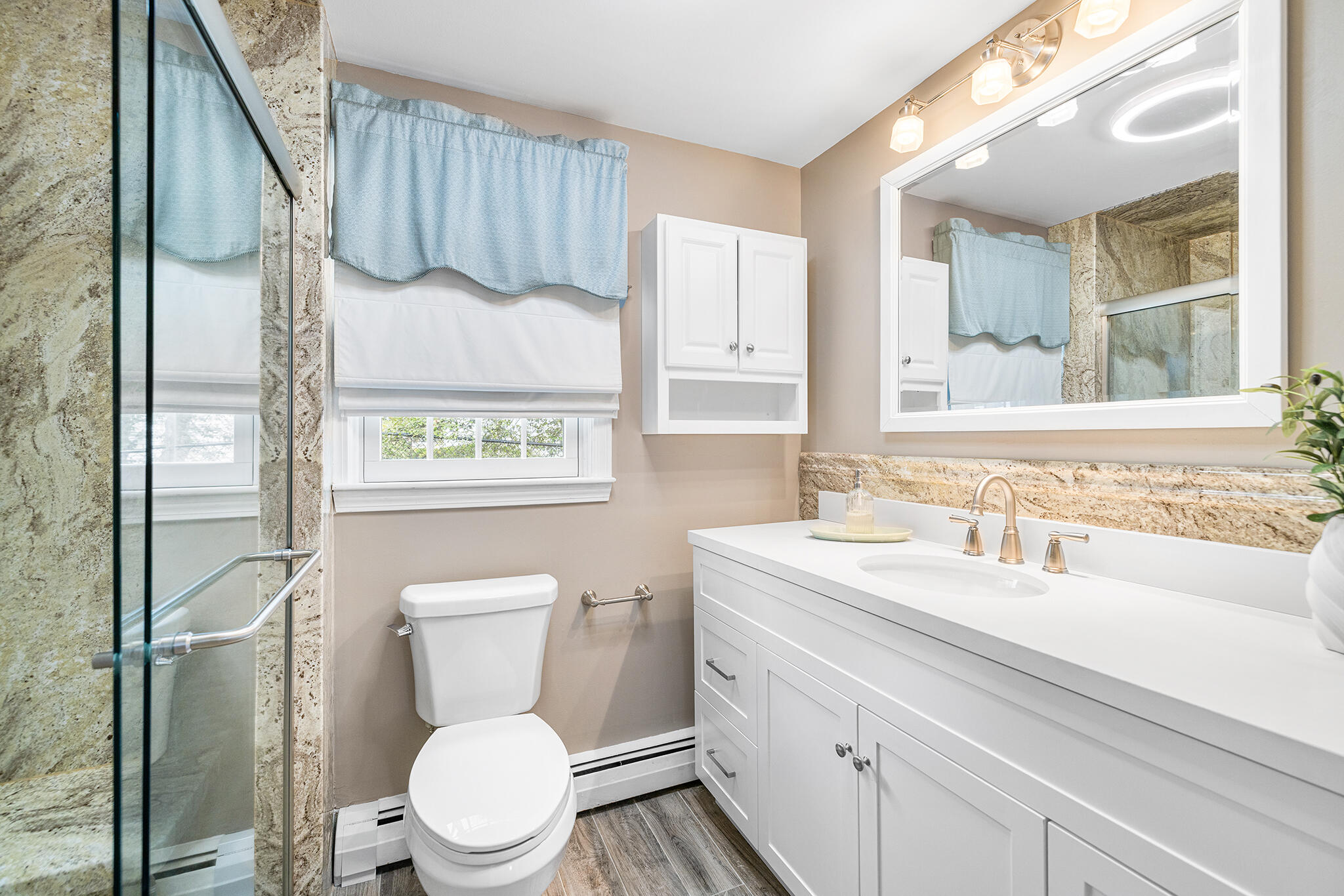 175 Old Post Road Centerville, MA 02632 - Photo 14 of 28 a bathroom with a toilet sink and mirror