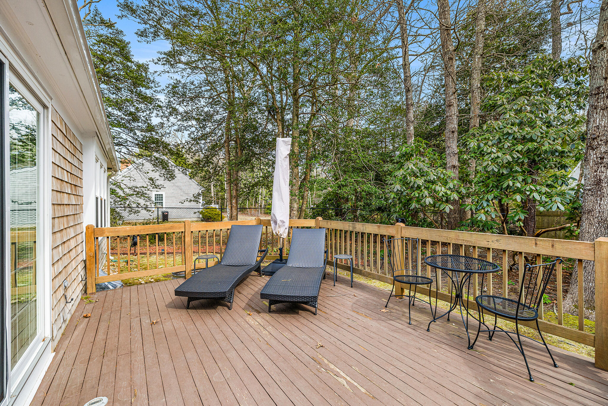 175 Old Post Road Centerville, MA 02632 - Photo 24 of 28 a balcony with wooden floor table and chairs