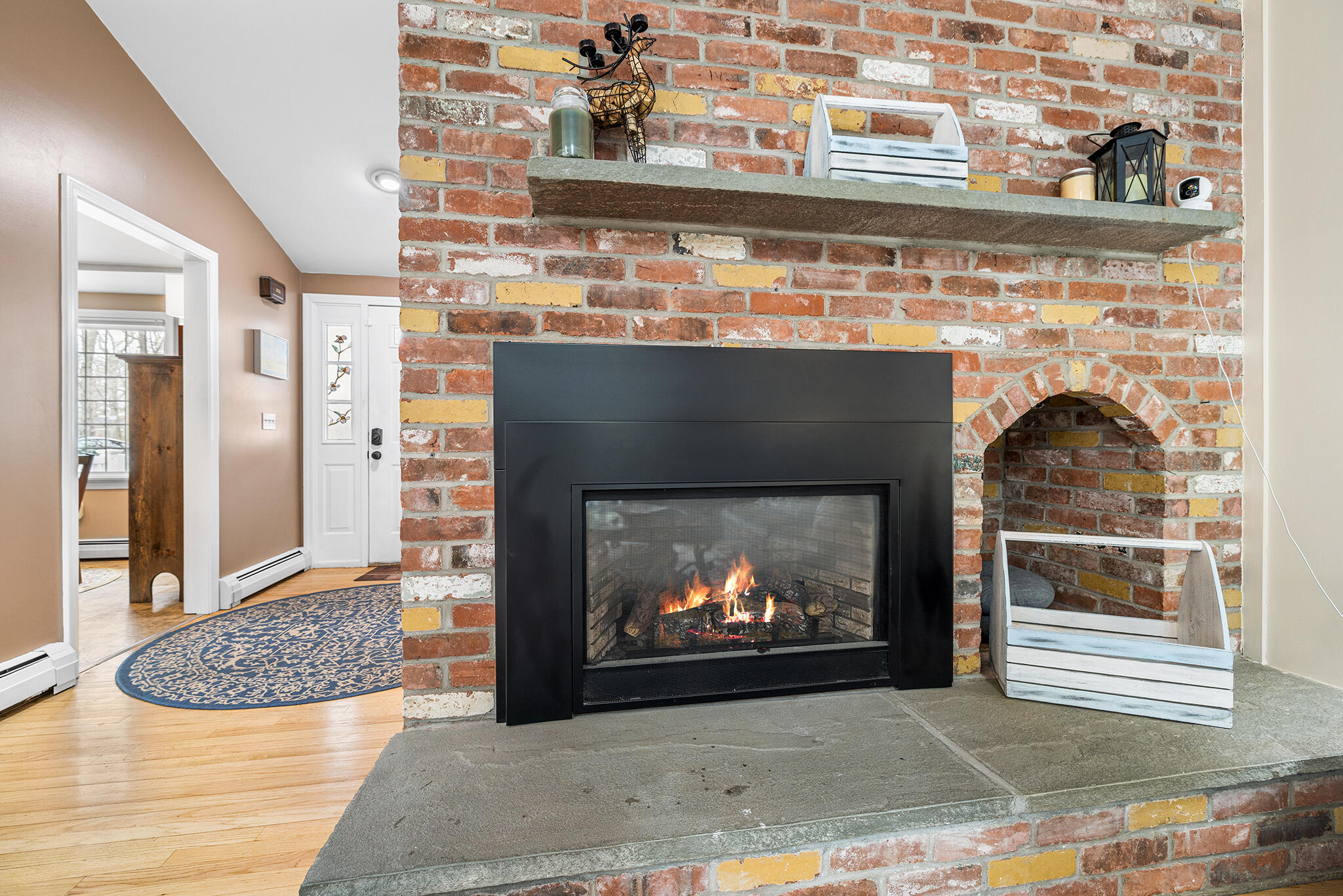 175 Old Post Road Centerville, MA 02632 - Photo 10 of 28 a living room with a fireplace and a fireplace