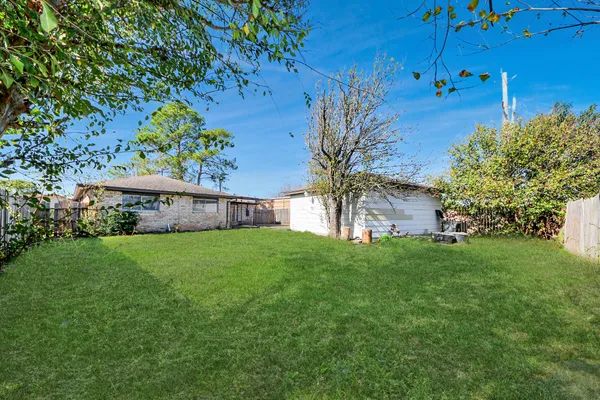 a backyard of a house with lots of green space
