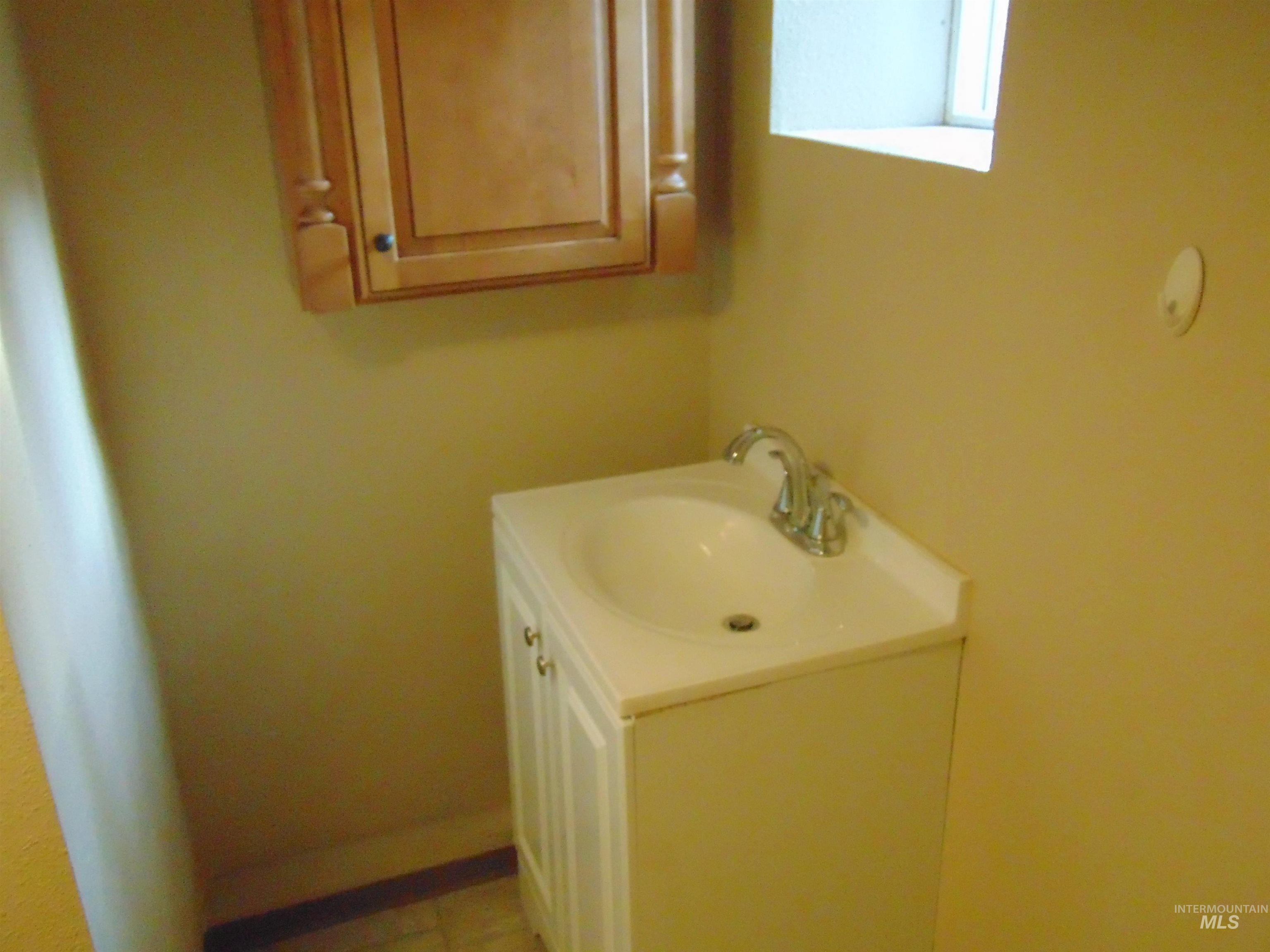 1825 7th Avenue Lewiston, ID 83501 - Photo 18 of 26 Bathroom with vanity and light tile patterned flooring