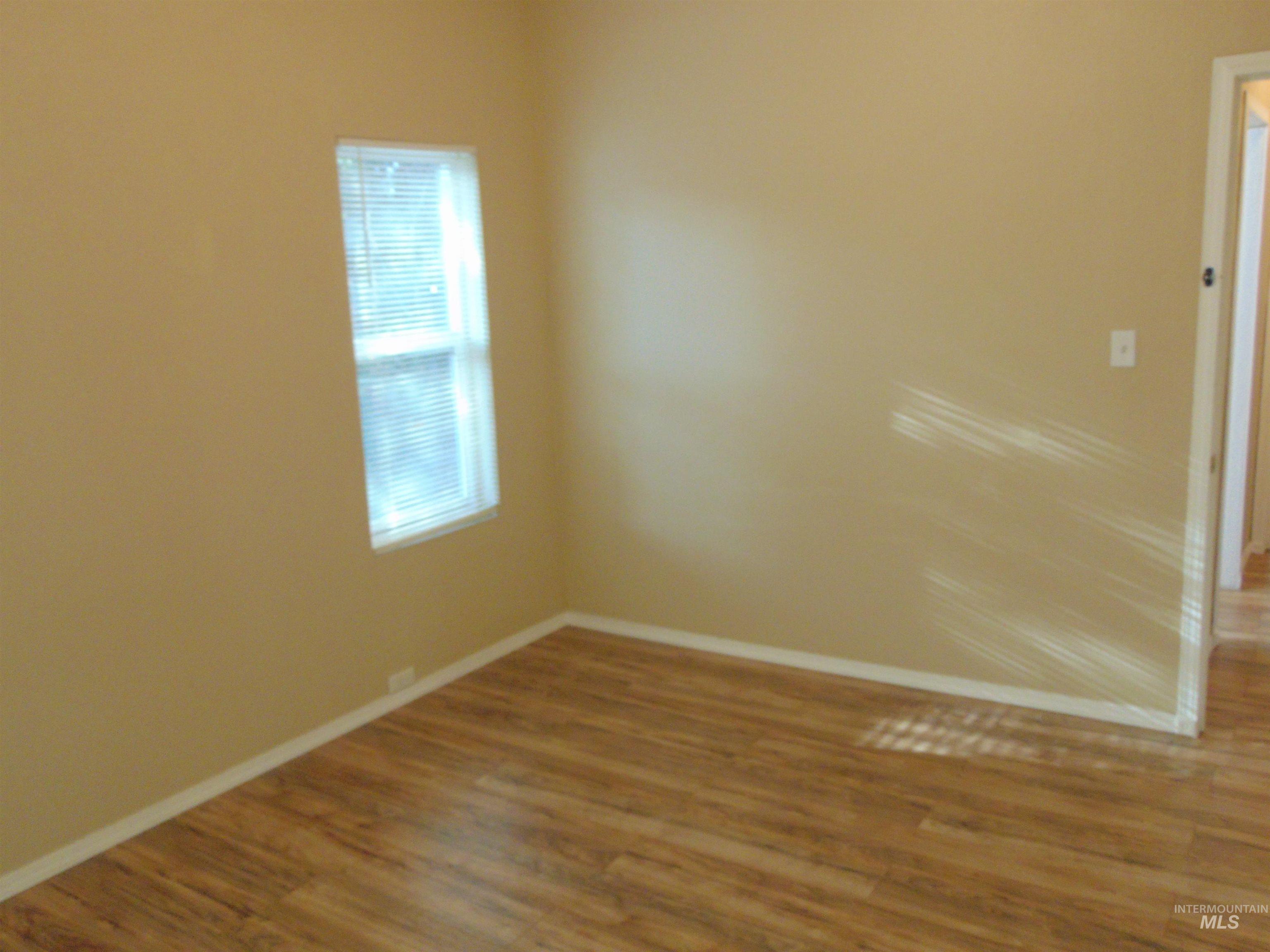 1825 7th Avenue Lewiston, ID 83501 - Photo 6 of 26 Unfurnished room featuring wood finished floors