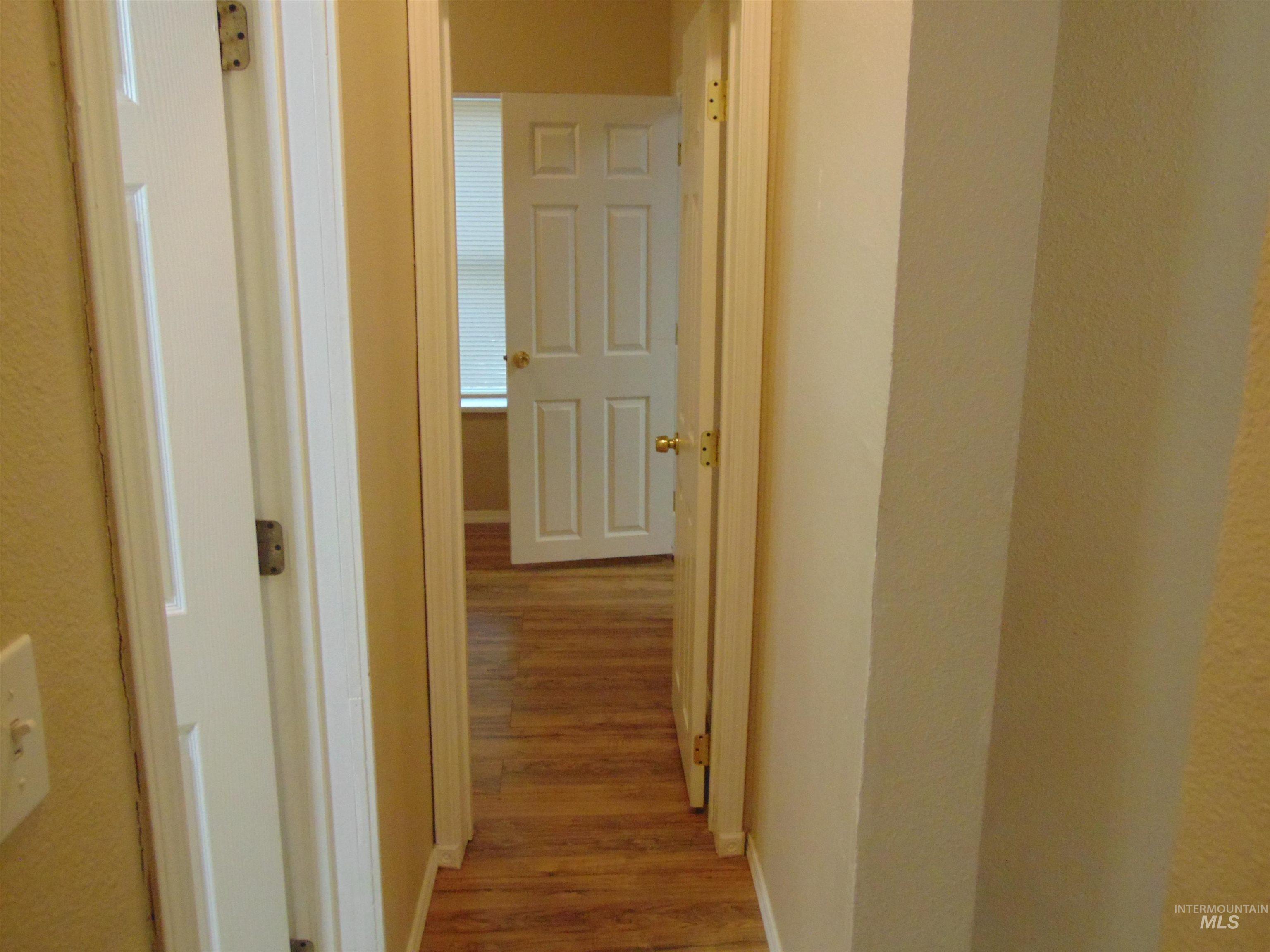 1825 7th Avenue Lewiston, ID 83501 - Photo 8 of 26 Hallway featuring light wood-type flooring and baseboards