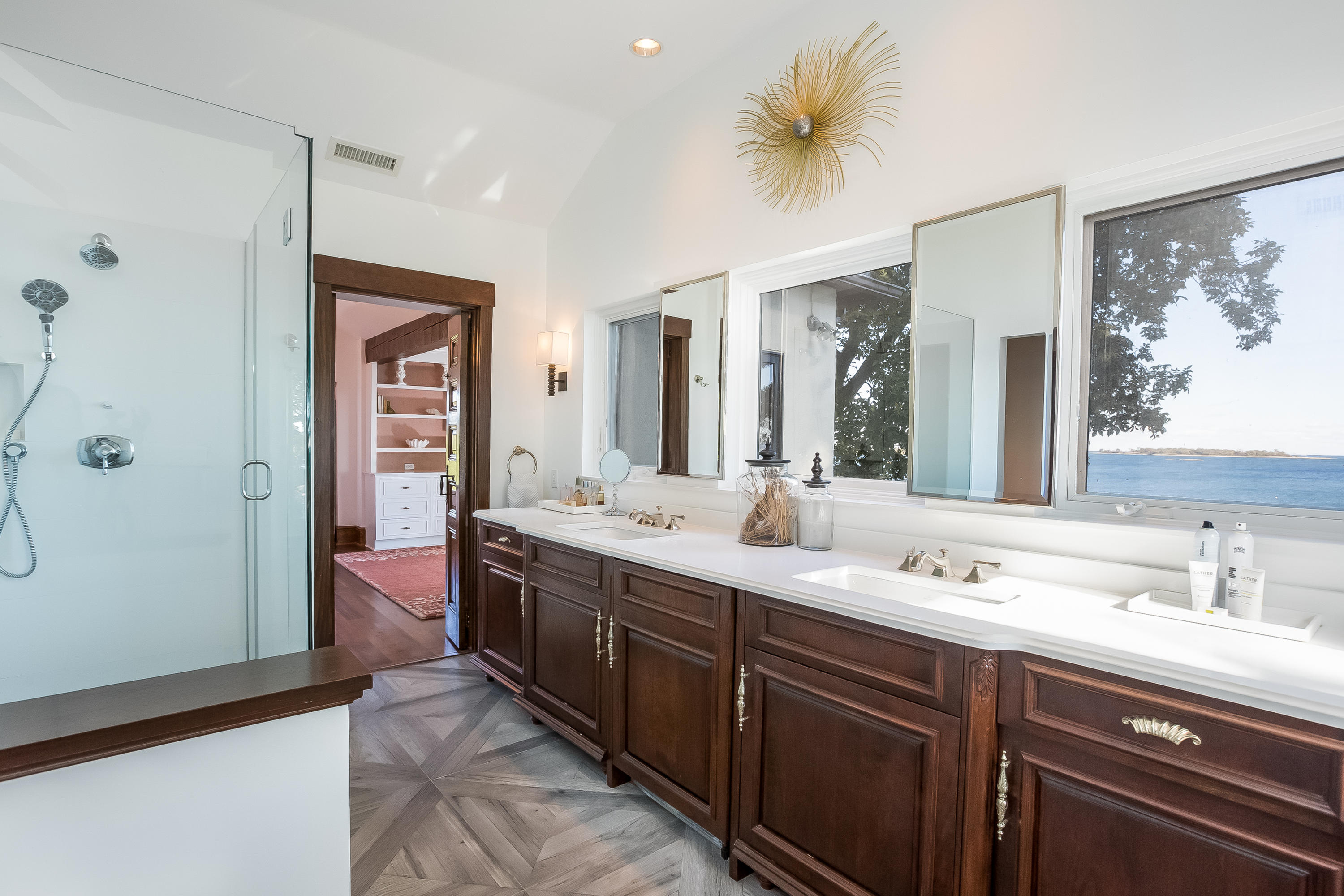 8 Woodland Road Norwalk, CT 06854 - Photo 22 of 44 a spacious bathroom with a double vanity sink mirror and double
