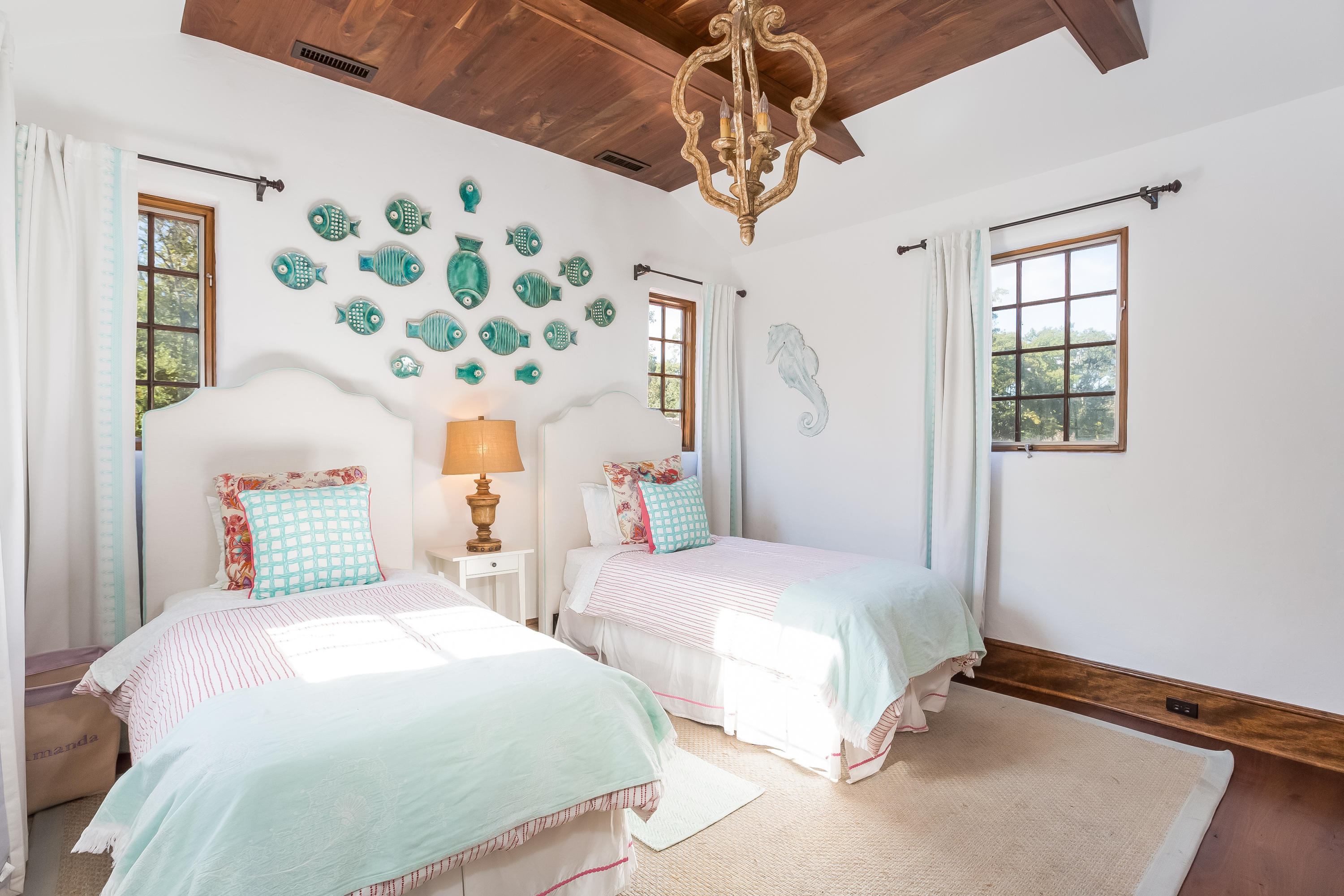 8 Woodland Road Norwalk, CT 06854 - Photo 25 of 44 a bedroom with two beds and a chandelier