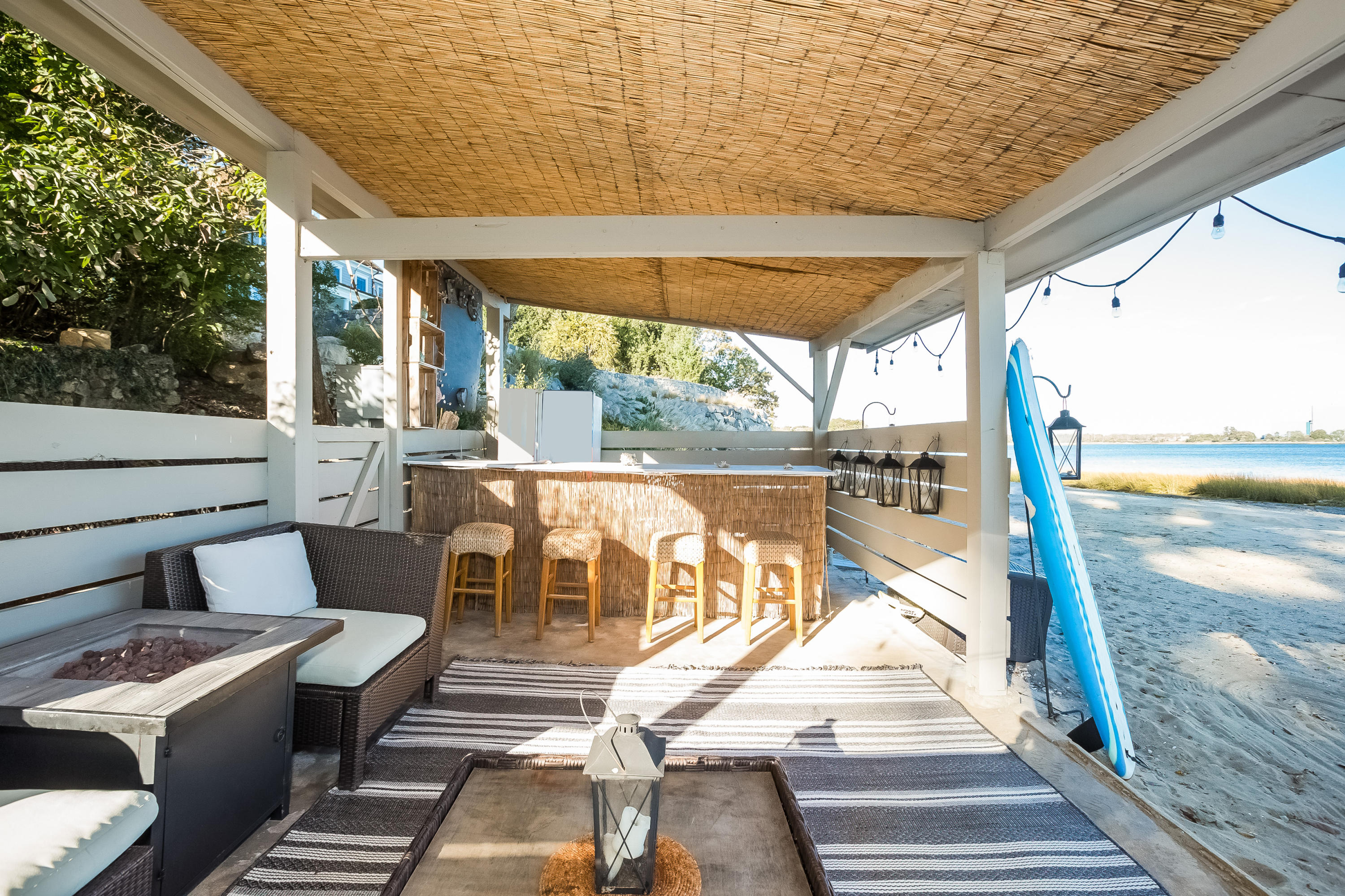 8 Woodland Road Norwalk, CT 06854 - Photo 33 of 44 a view of a patio with a table chairs and wooden floor