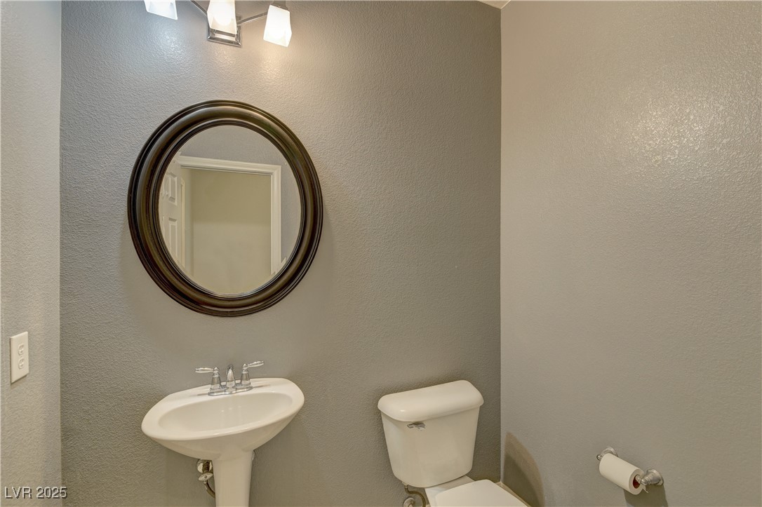 972 Rue Grand Paradis Lane Henderson, NV 89011 - Photo 24 of 32 Bathroom with toilet and a textured wall