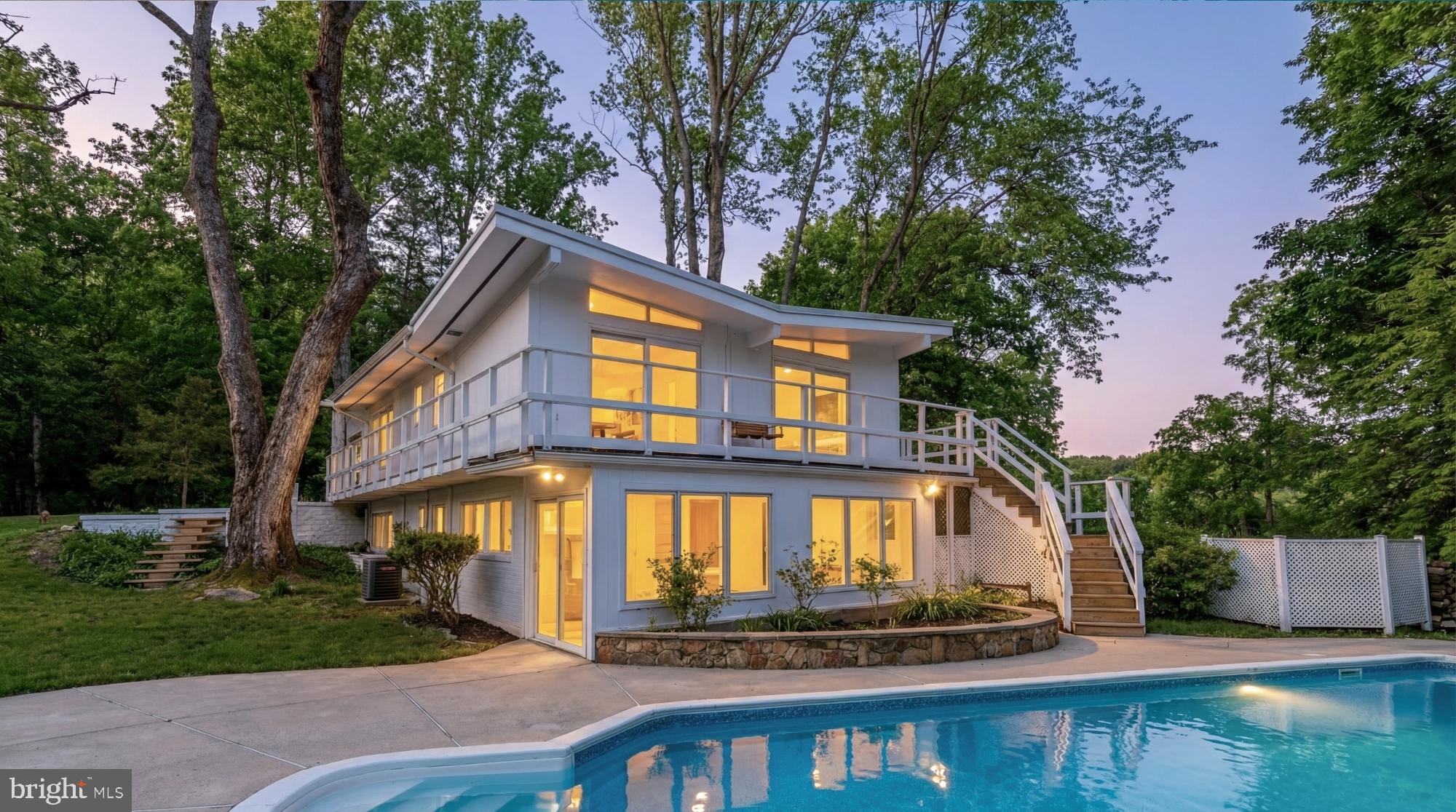 10903 Beach Mill Road Great Falls, VA 22066 - Photo 1 of 25 Set on 2.3 acres in the heart of Great Falls