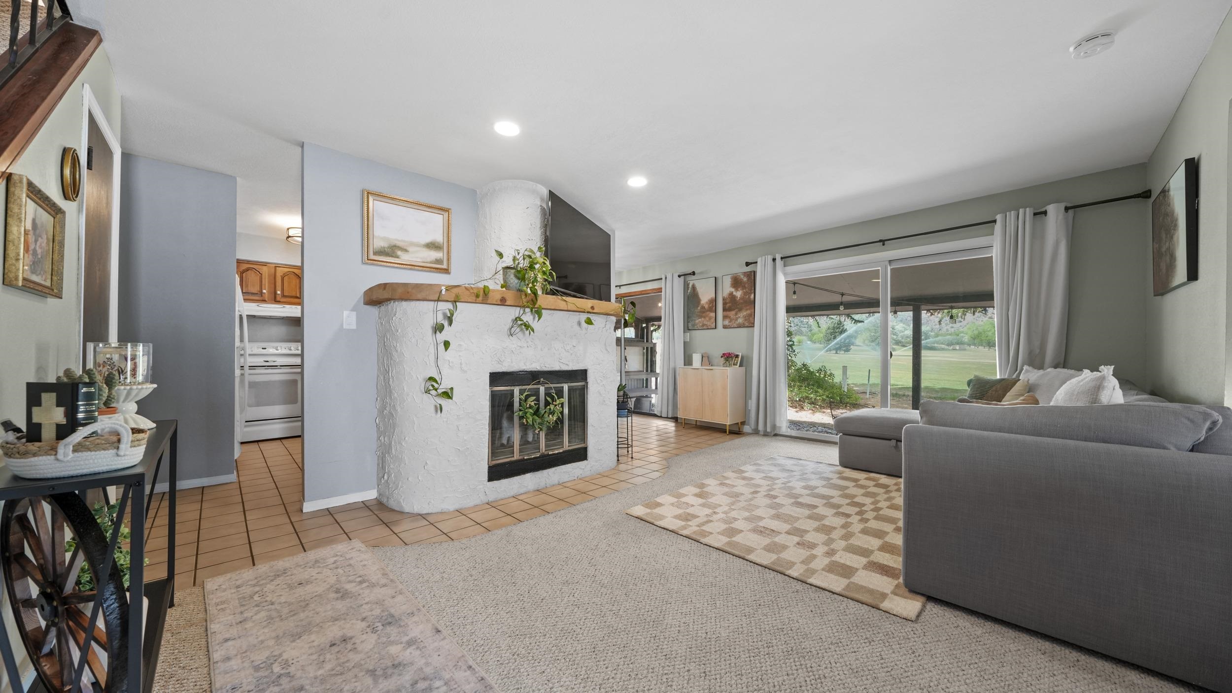 507 Rado Drive, Unit D Grand Junction, CO 81507 - Photo 2 of 34 a living room with furniture a window and a fireplace
