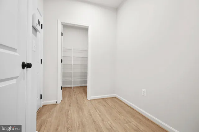 a bathroom with a double vanity sink toilet mirror and shower