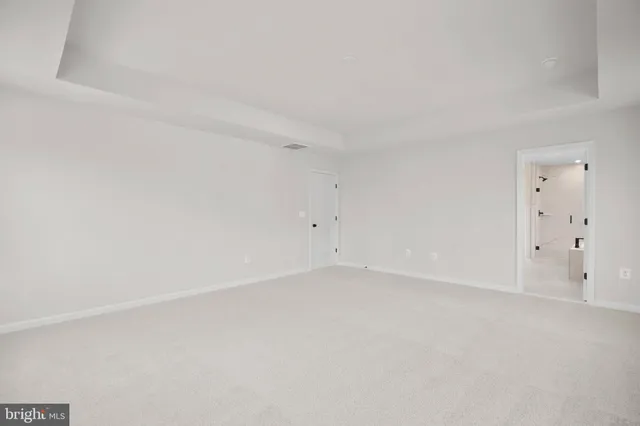 a bathroom with a shower sink and mirror