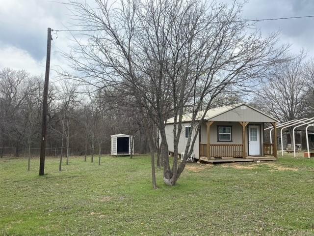 256 Chisholm Trail Valley View, TX 76272 - Photo 1 of 1 a front view of a house with a yard