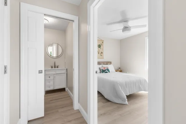 a bathroom with a sink toilet and a mirror