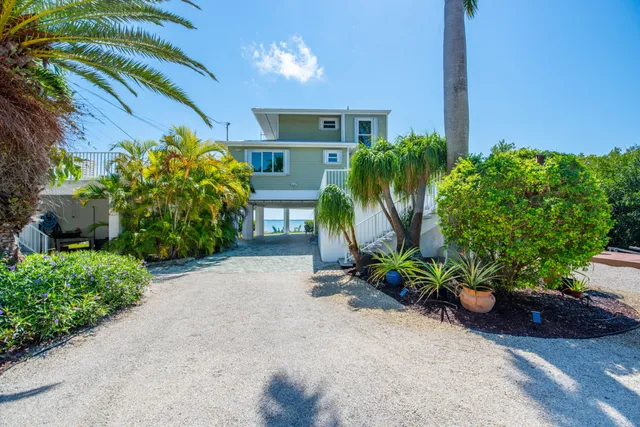 a view of a backyard with swimming pool