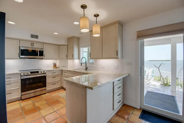 a bed room with a bed and a potted plant