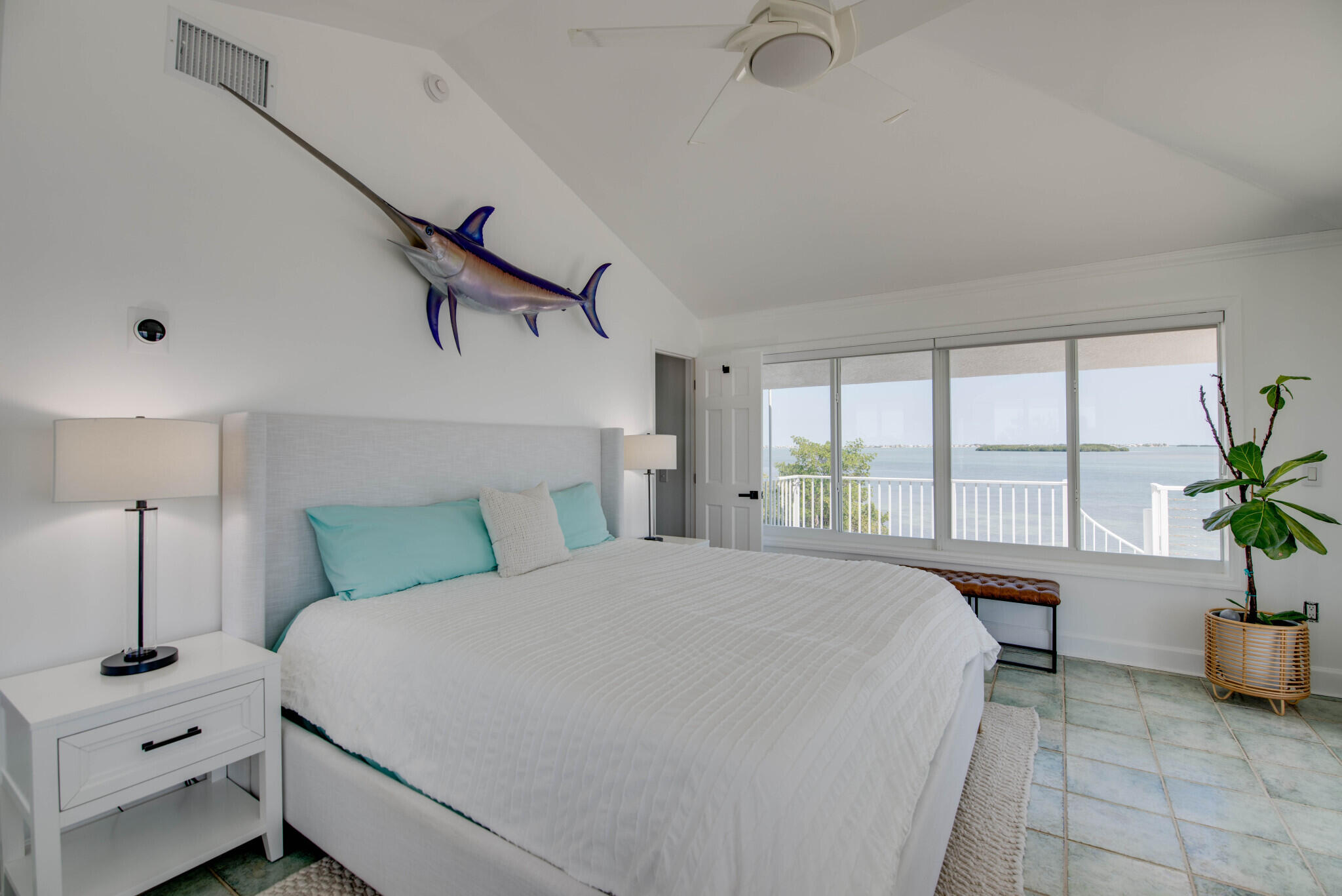 1176 Thatch Lane Cudjoe, FL 33042 - Photo 25 of 41 a bed room with a bed and a potted plant