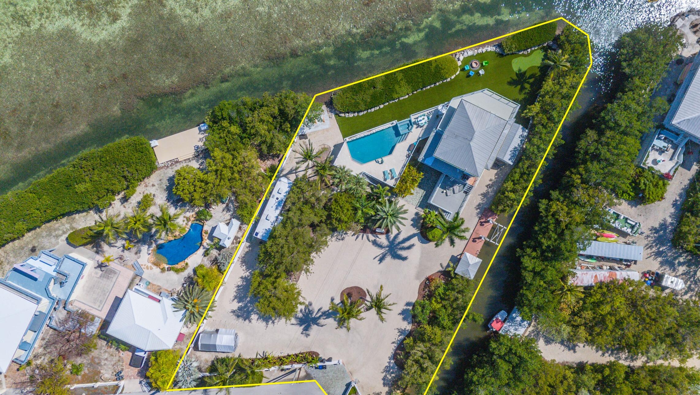 1176 Thatch Lane Cudjoe, FL 33042 - Photo 3 of 41 an aerial view of a house