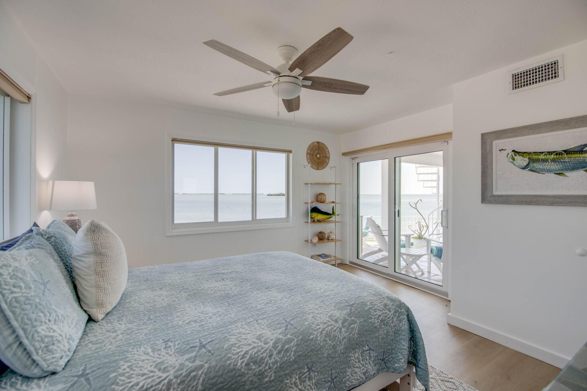 1176 Thatch Lane Cudjoe, FL 33042 - Photo 31 of 41 a bedroom with a large bed and a window