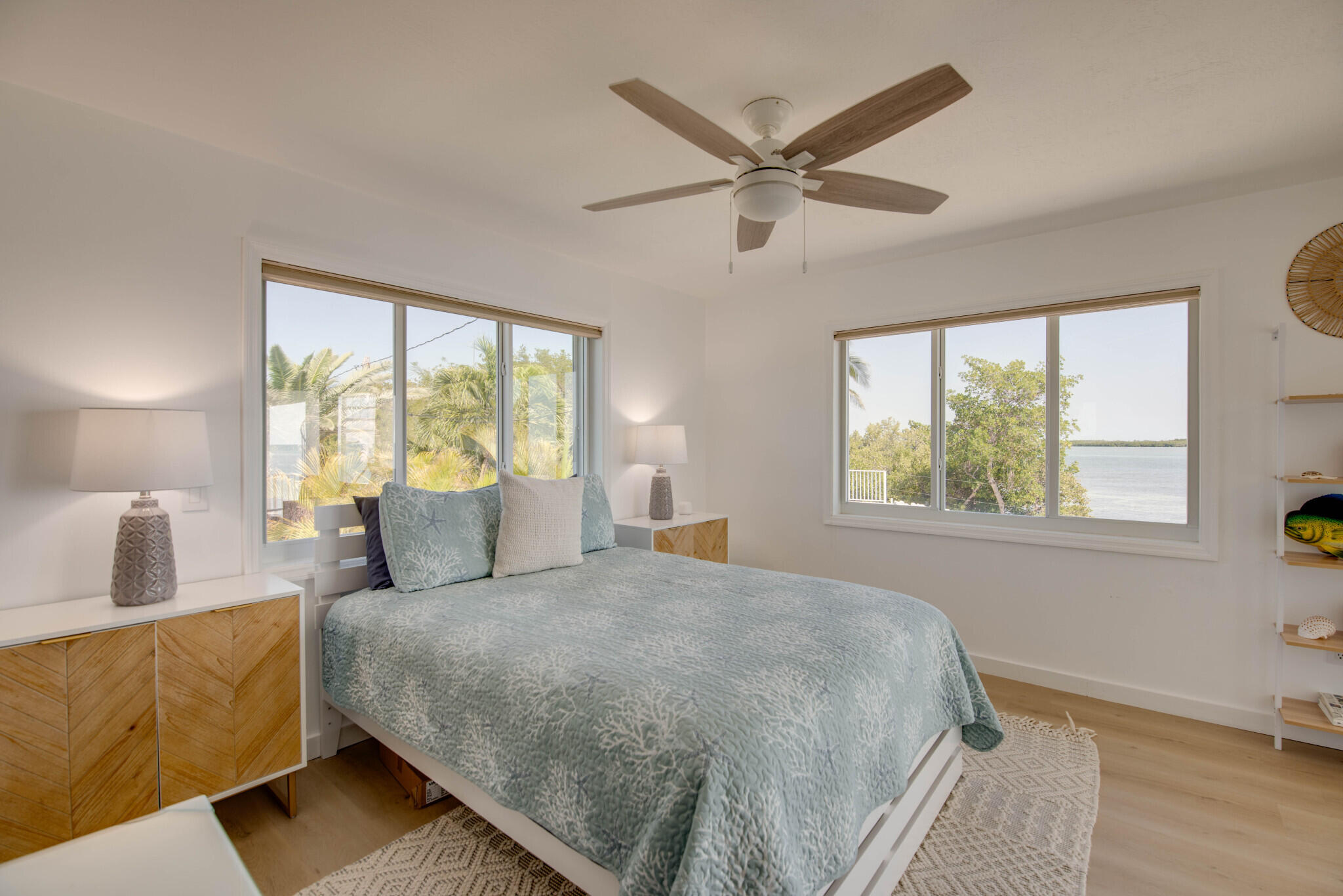 1176 Thatch Lane Cudjoe, FL 33042 - Photo 32 of 41 a bedroom with a large bed and a window