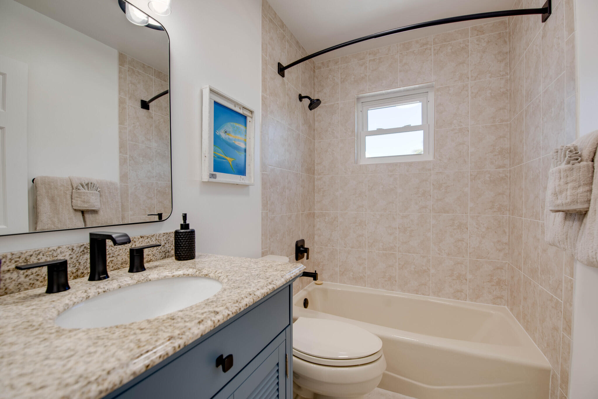 1176 Thatch Lane Cudjoe, FL 33042 - Photo 33 of 41 a bathroom with a granite countertop sink a toilet and shower