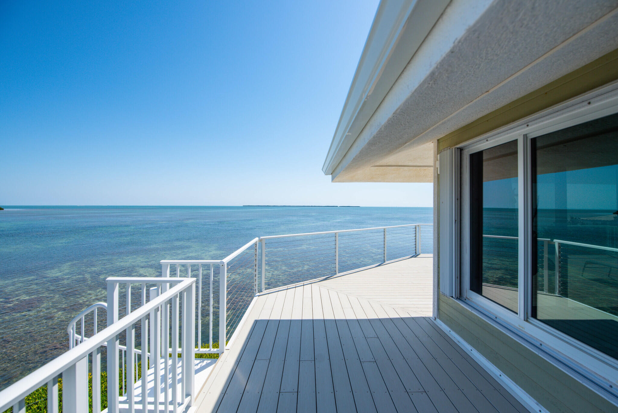 1176 Thatch Lane Cudjoe, FL 33042 - Photo 35 of 41 a view of balcony with wooden floor