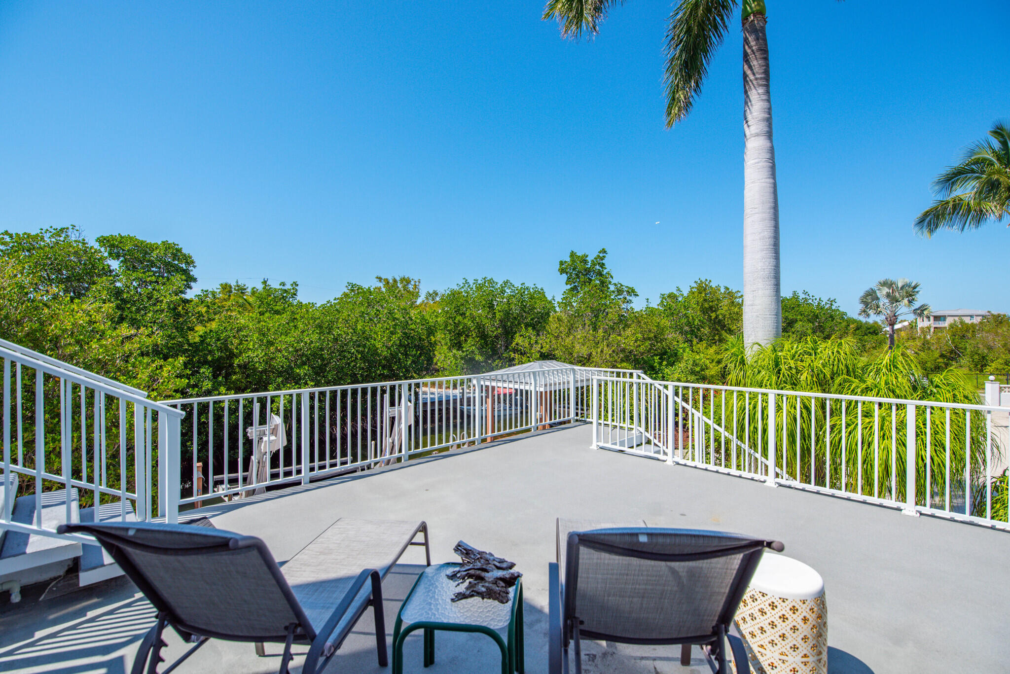 1176 Thatch Lane Cudjoe, FL 33042 - Photo 39 of 41 a view of a chair and table on the deck