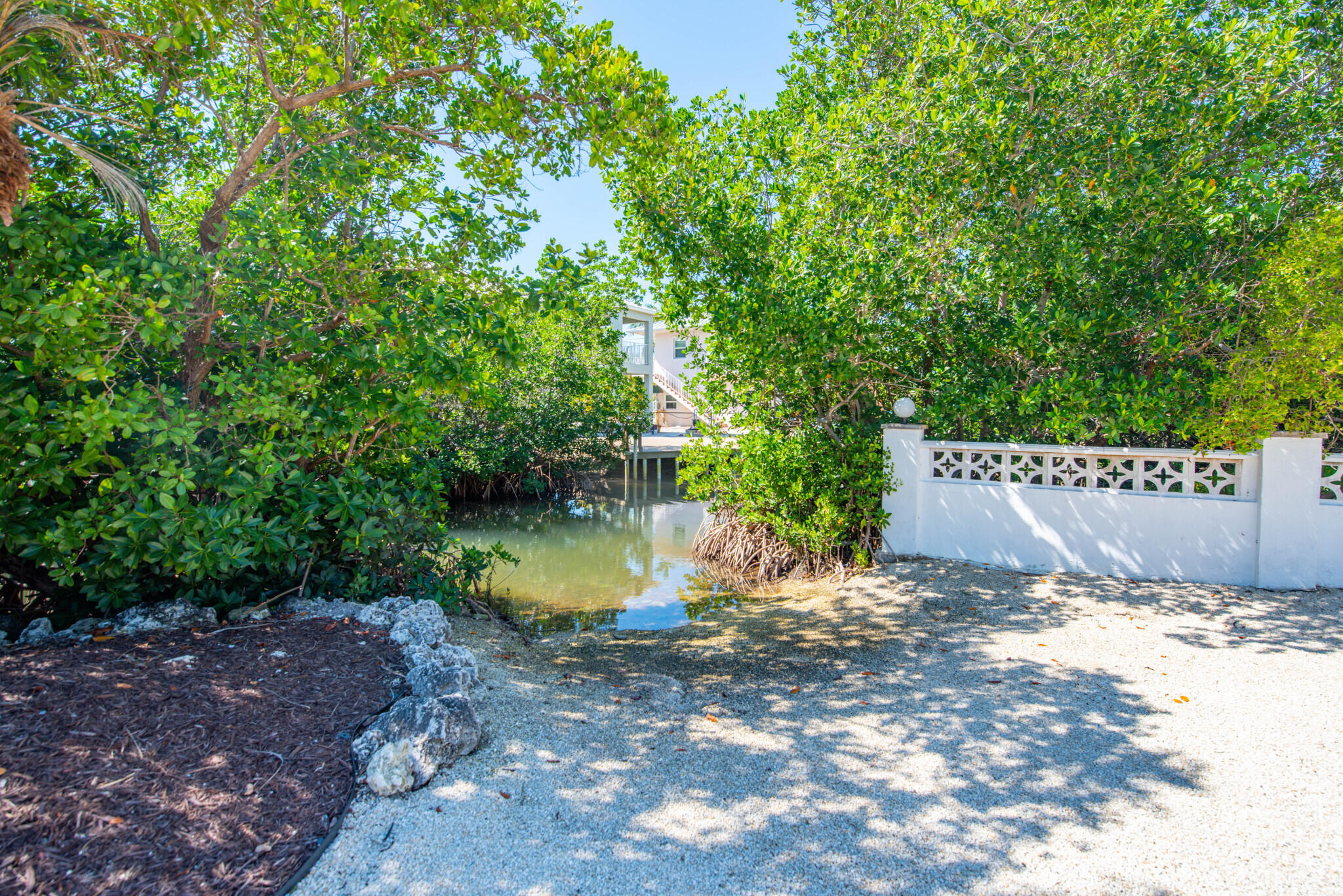 1176 Thatch Lane Cudjoe, FL 33042 - Photo 40 of 41 a view of a water fountain with large trees