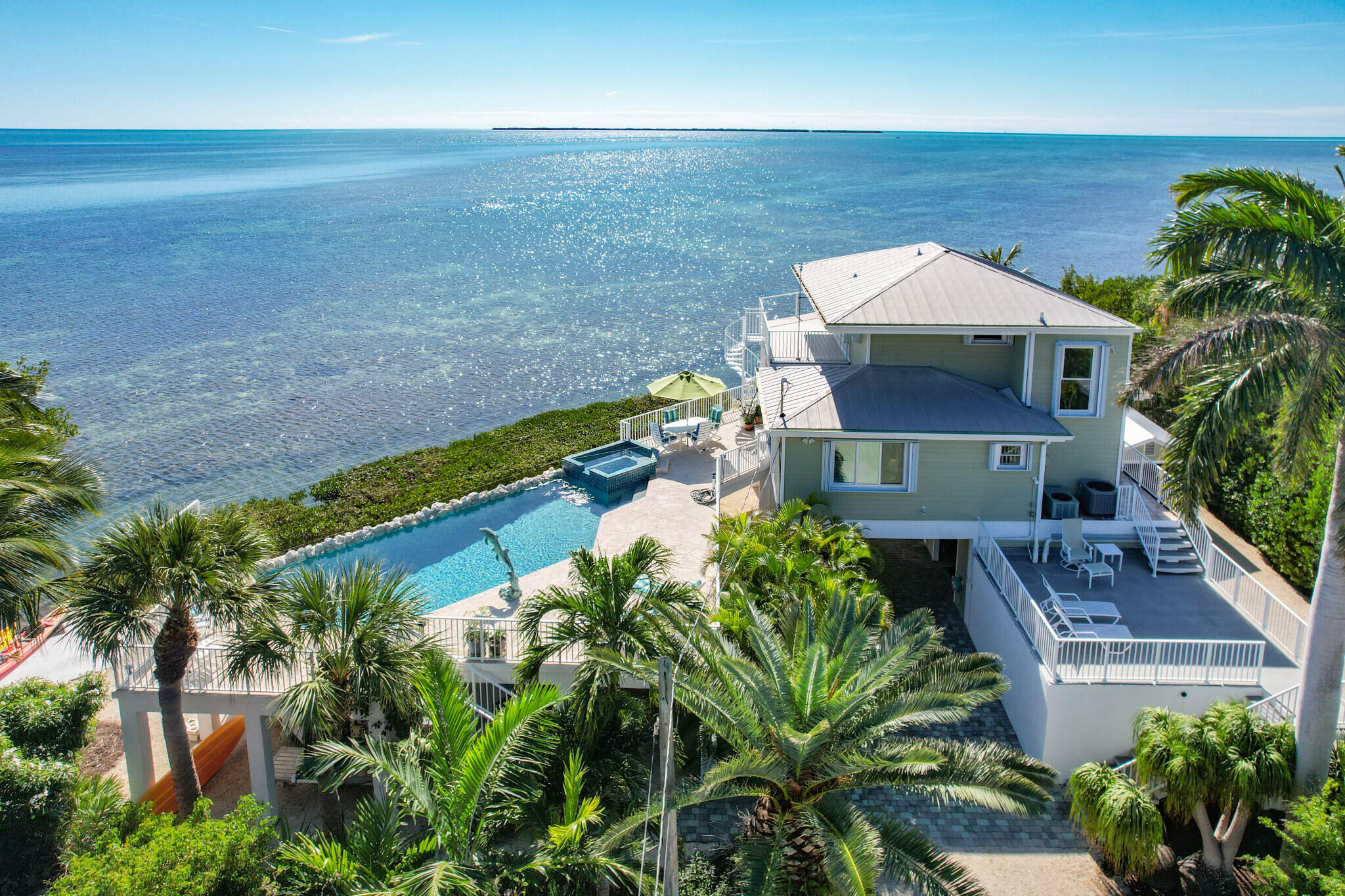1176 Thatch Lane Cudjoe, FL 33042 - Photo 4 of 41 a view of a house with a yard
