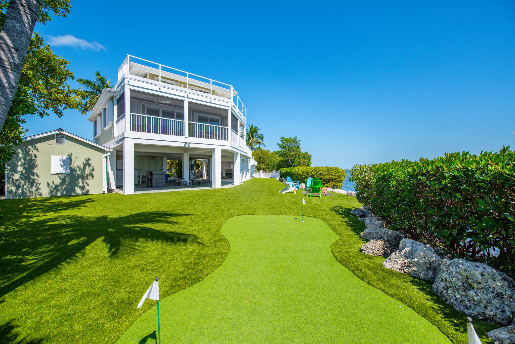 1176 Thatch Lane Cudjoe, FL 33042 - Photo 7 of 41 a swimming pool with outdoor seating and yard