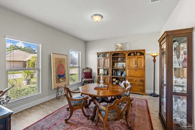 a view of a dining room with furniture window and outside view