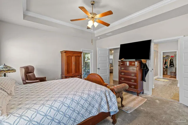 a bedroom with bed and tv