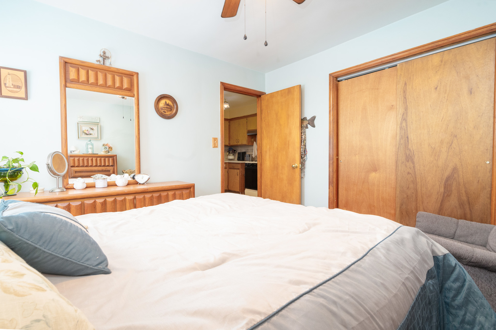 4225 West Marquette Road Chicago, IL 60629 - Photo 16 of 26 a bedroom with a bed and a dresser