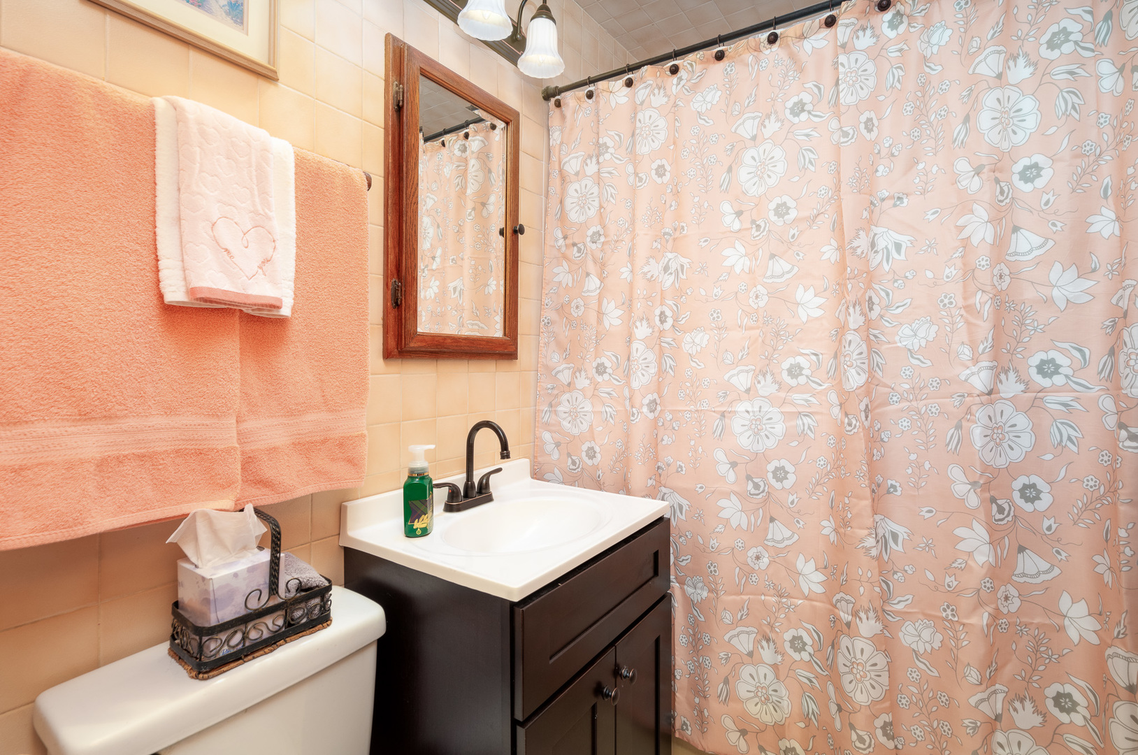 4225 West Marquette Road Chicago, IL 60629 - Photo 17 of 26 a bathroom with a sink a mirror and a shower curtain