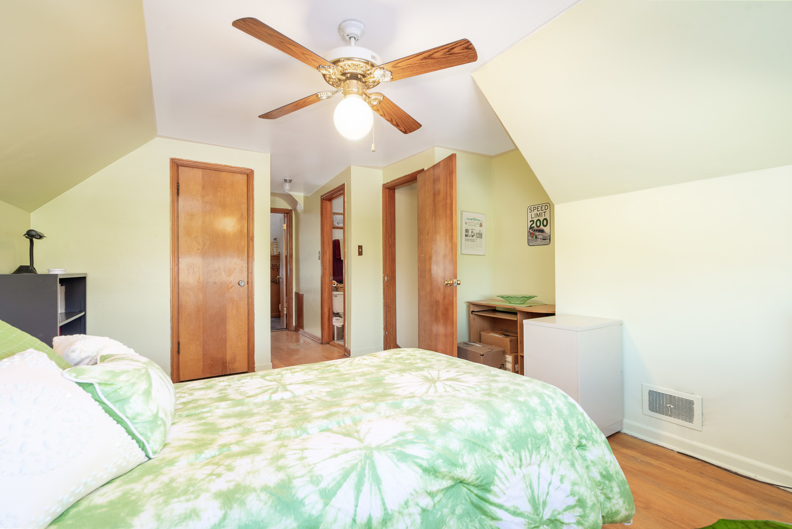 4225 West Marquette Road Chicago, IL 60629 - Photo 19 of 26 a bedroom with a large bed and a chandelier