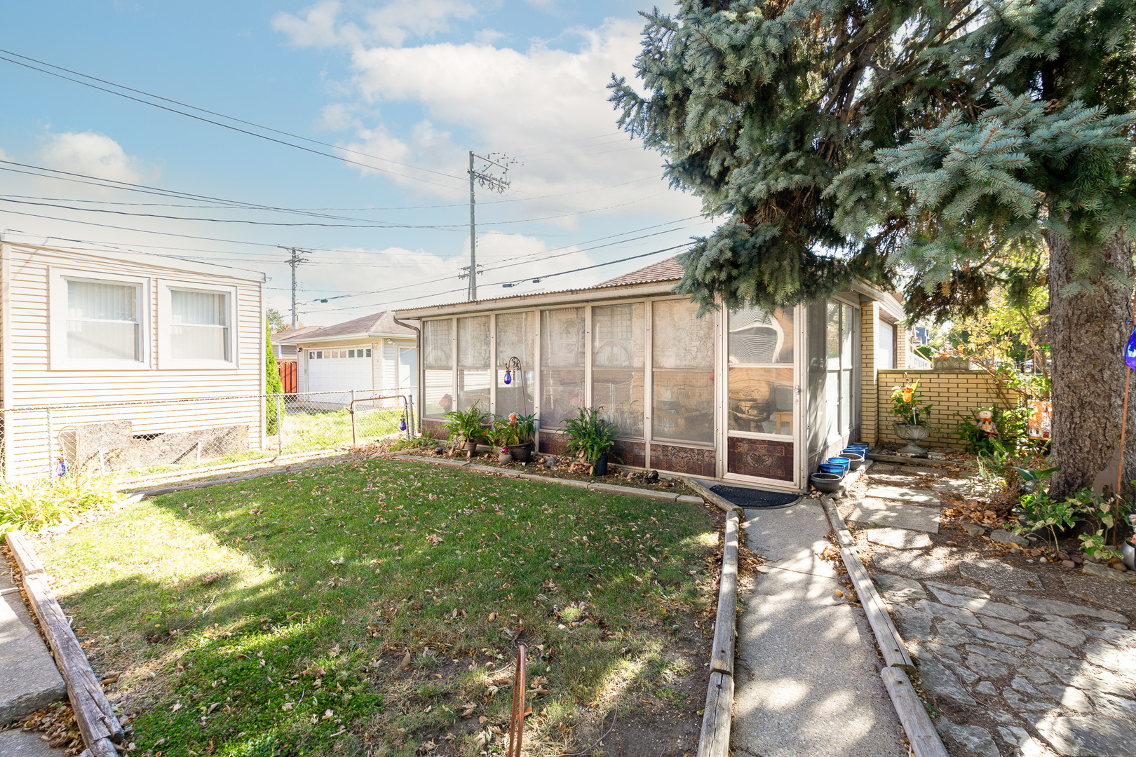4225 West Marquette Road Chicago, IL 60629 - Photo 2 of 26 a view of a house with backyard and sitting area