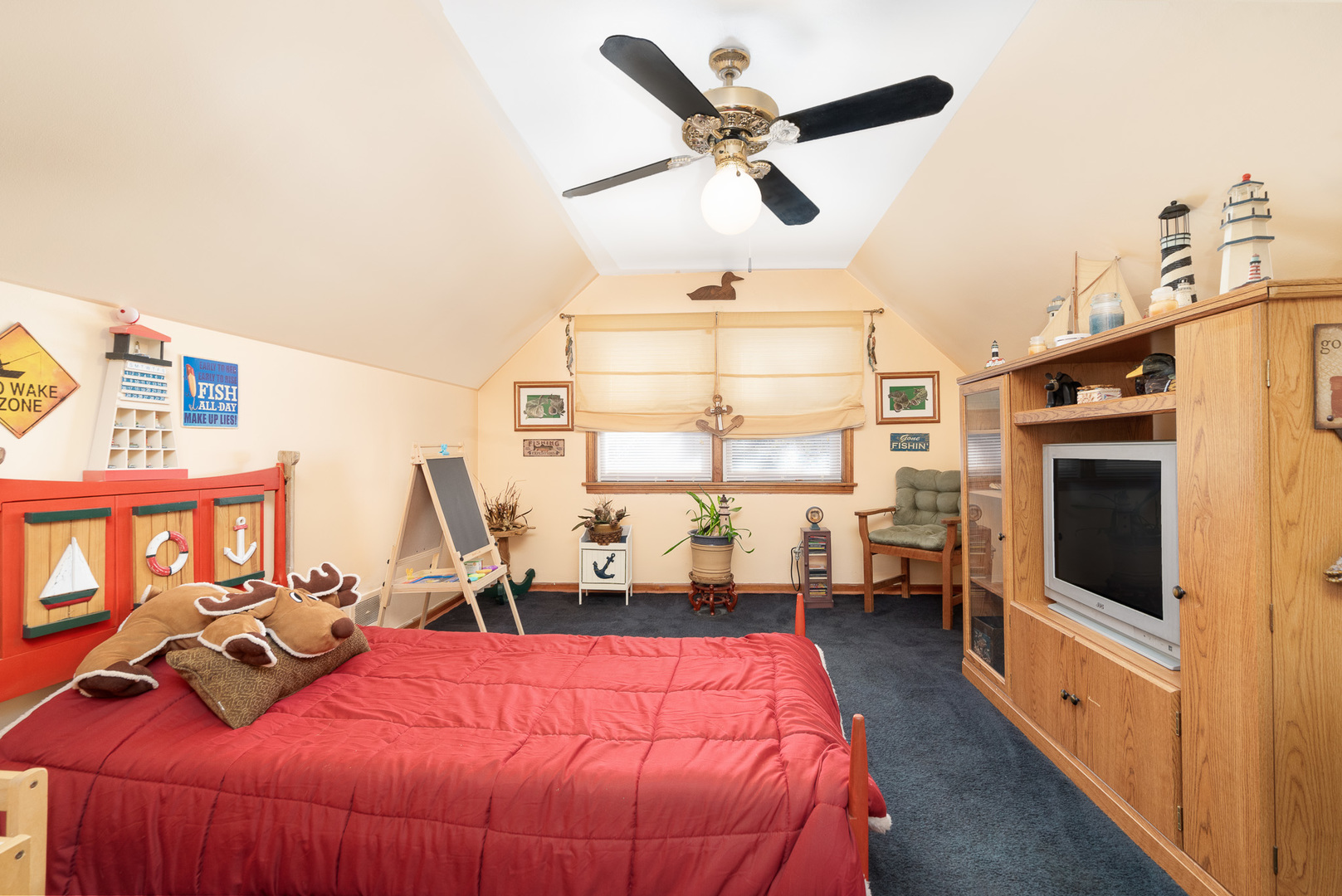 4225 West Marquette Road Chicago, IL 60629 - Photo 21 of 26 a bed room with a bed a television and a large window