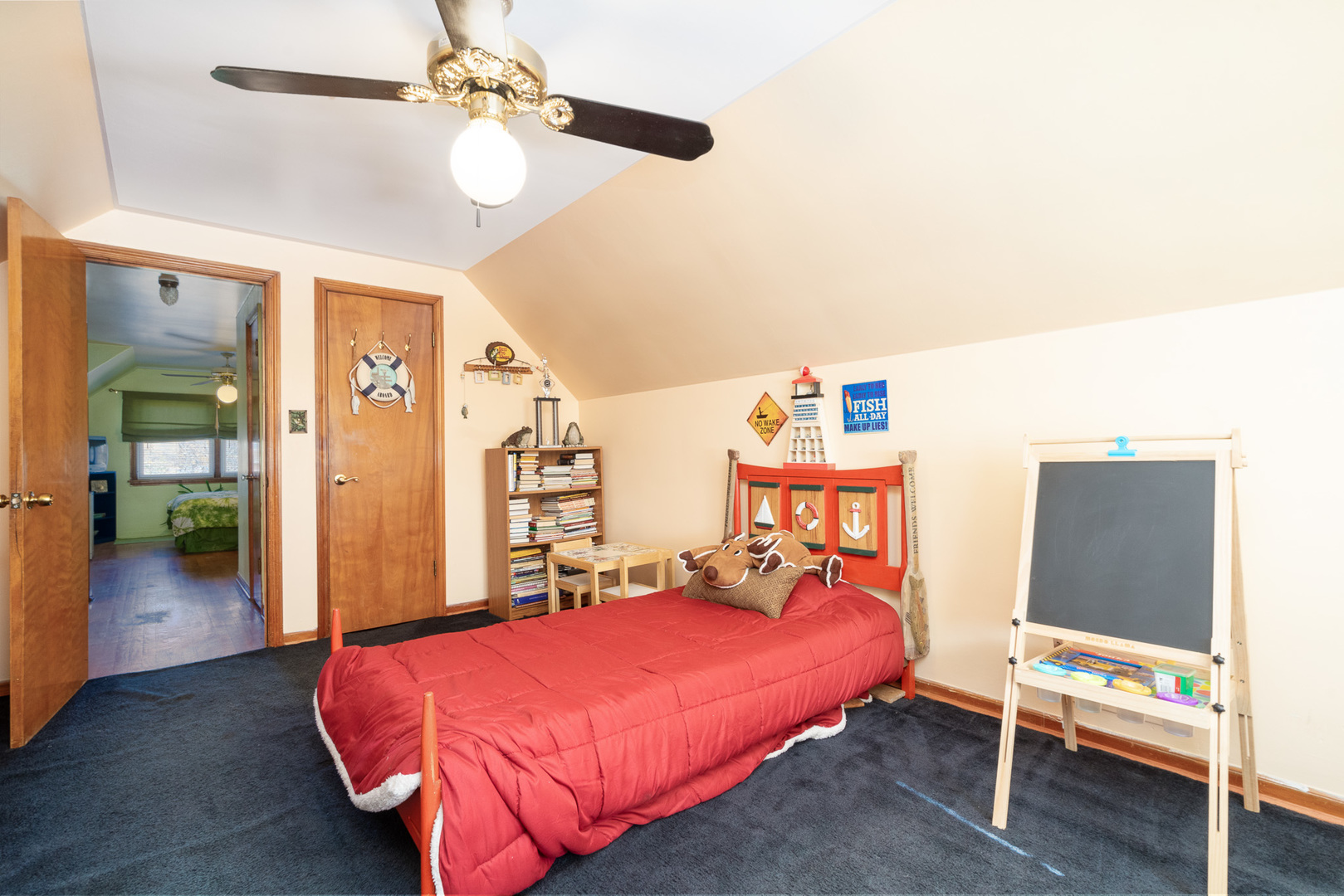 4225 West Marquette Road Chicago, IL 60629 - Photo 22 of 26 a bedroom with a bed and a chandelier