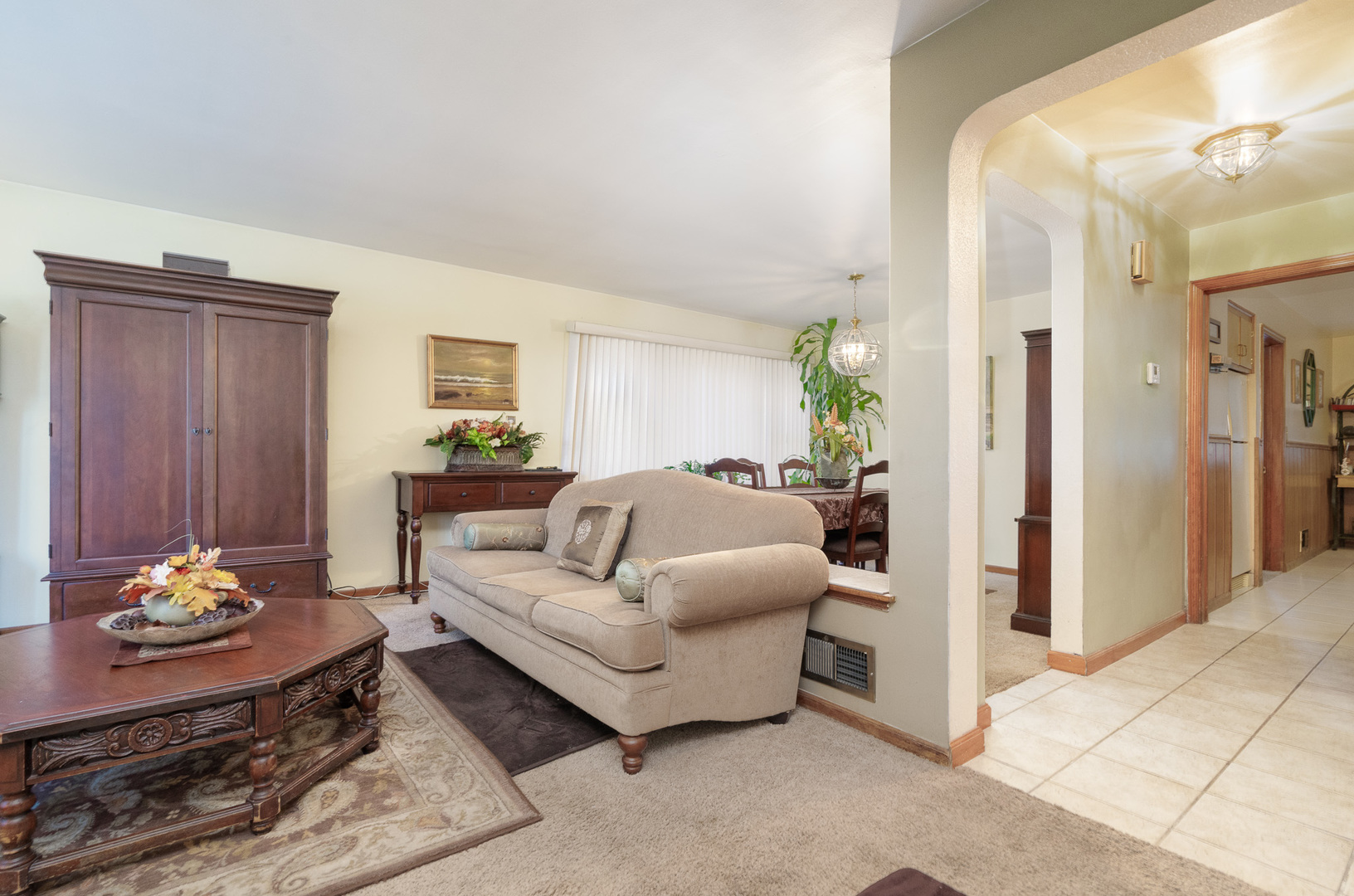 4225 West Marquette Road Chicago, IL 60629 - Photo 8 of 26 a living room with furniture flowerpot and a chandelier