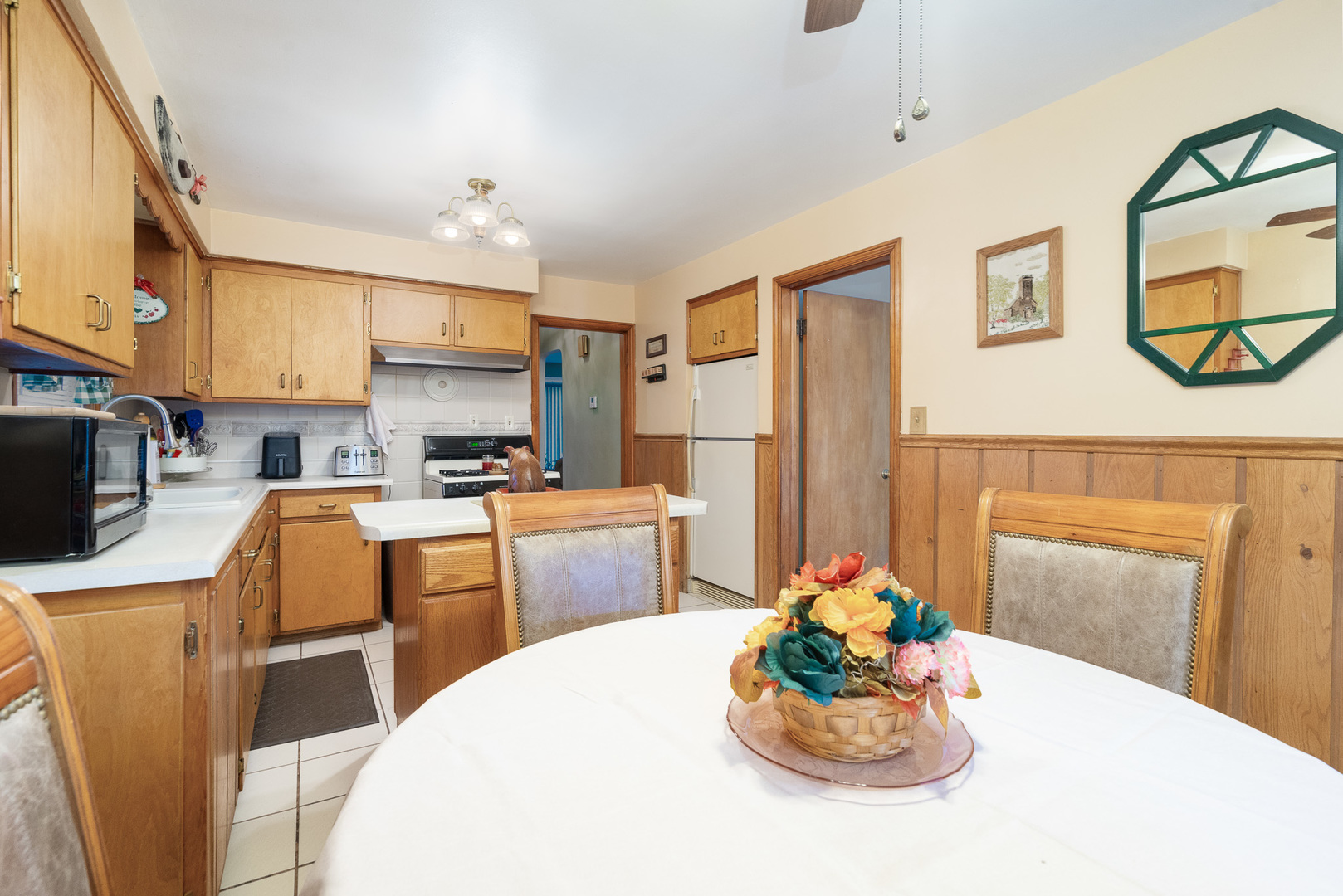4225 West Marquette Road Chicago, IL 60629 - Photo 10 of 26 a kitchen with a refrigerator and a stove