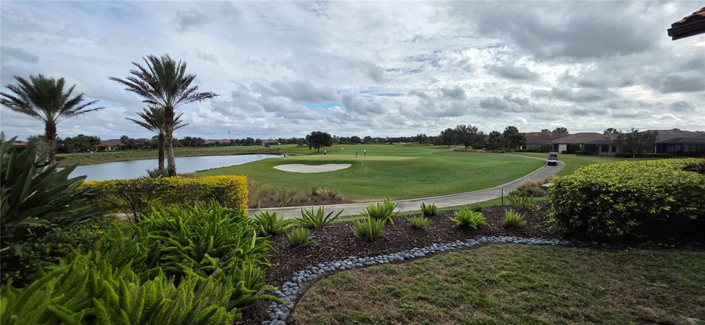 13608 Messina Loop, Unit 202 Bradenton, FL 34211 - Photo 53 of 73 a view of a garden with a fountain