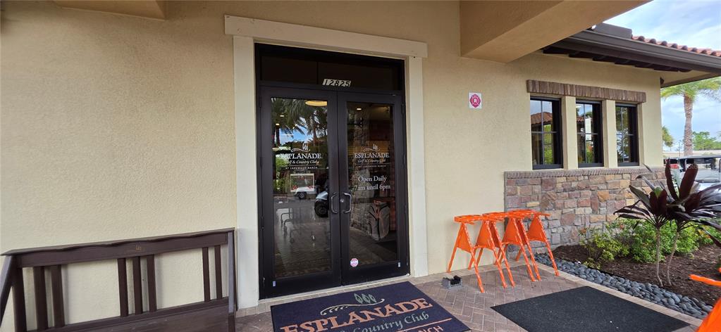 13608 Messina Loop, Unit 202 Bradenton, FL 34211 - Photo 65 of 73 front view of a house with a glass door