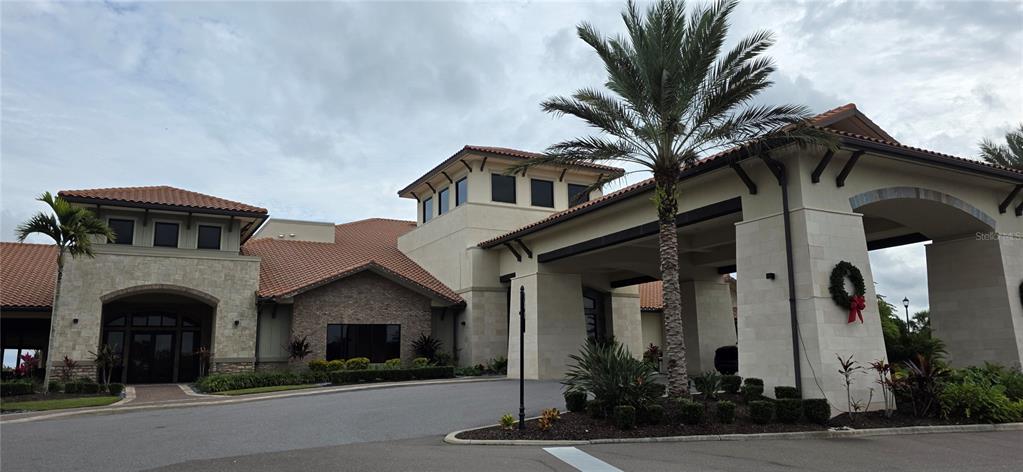 13608 Messina Loop, Unit 202 Bradenton, FL 34211 - Photo 70 of 73 a front view of a house with a yard